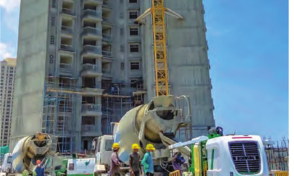 Stationary concrete pump at a high-rise construction site