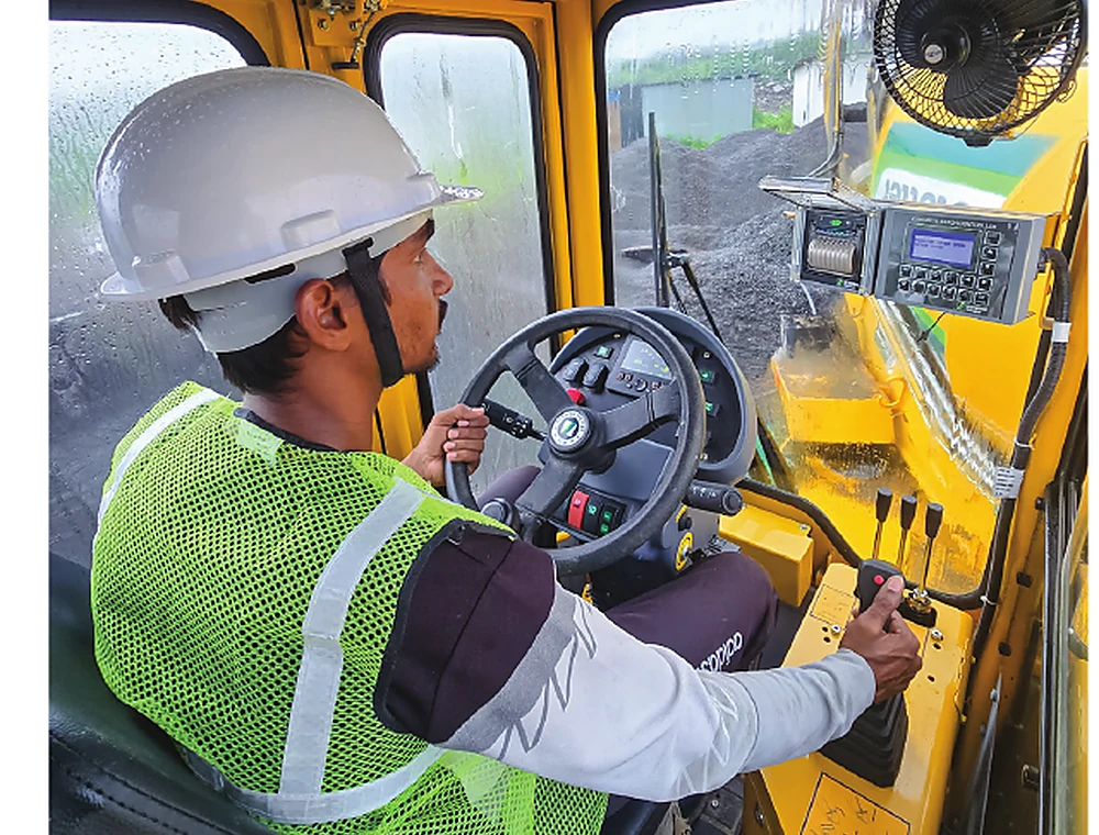 Operator inside the SCHWING self-loading mixer cabin